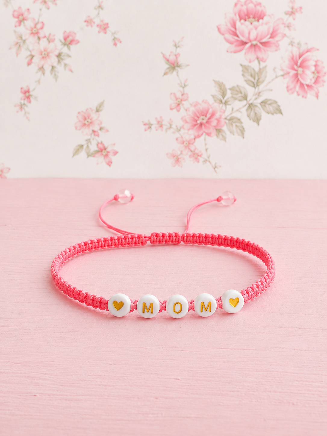 Pulsera Amor de Mamá en macramé rosado